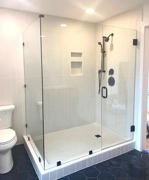 Modern bathroom with custom frameless glass shower enclosure—Speedy Glass offers residential glass solutions for homes