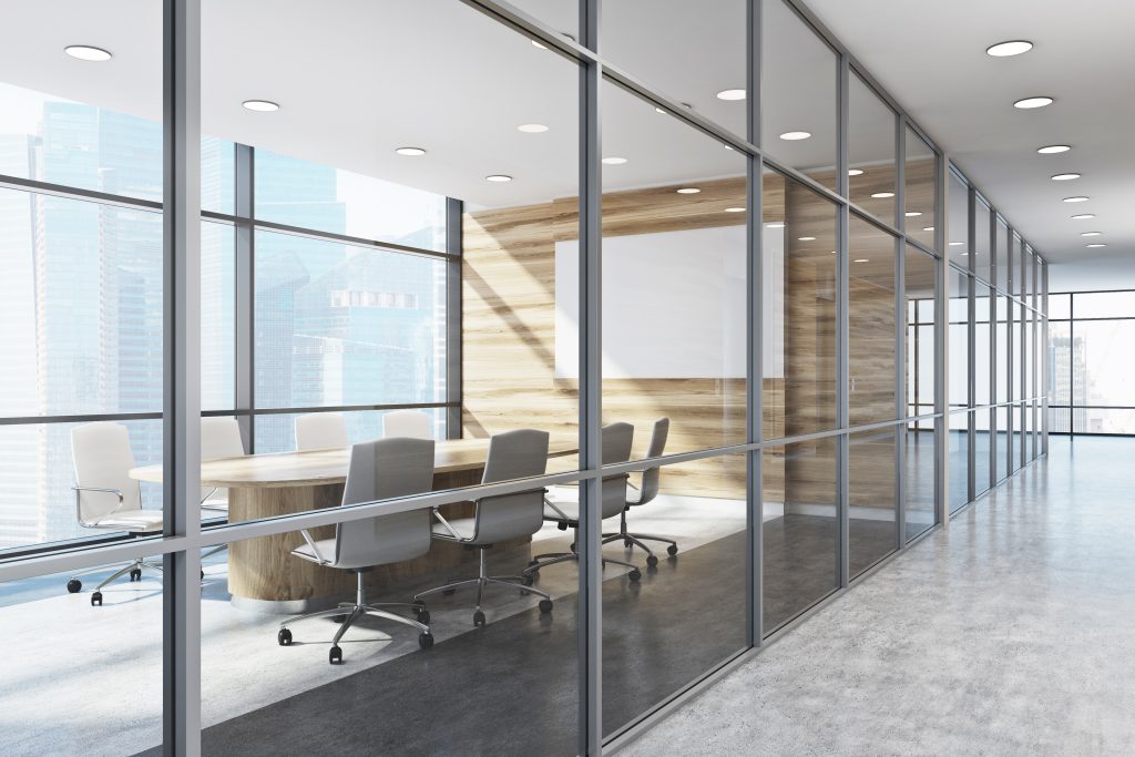 Modern office with glass-walled conference room—Speedy Glass provides custom interior glass partitions for commercial spaces