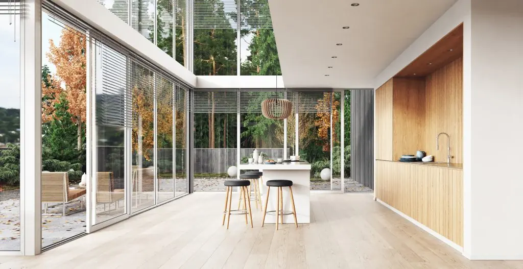 Modern kitchen with large sliding glass doors, bringing in natural light and style