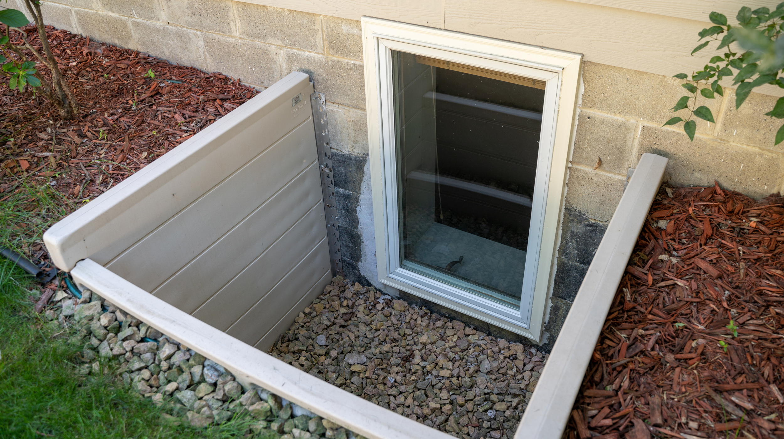Professional basement egress window replacement with window well installation for safety and code compliance.